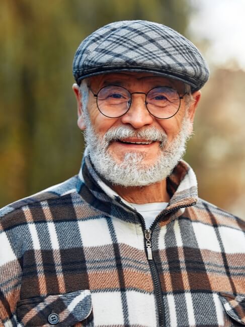 Elderly Man Smiling Outside Memory Care Facility Elderly Man Smiling Outside Memory Care Facility
